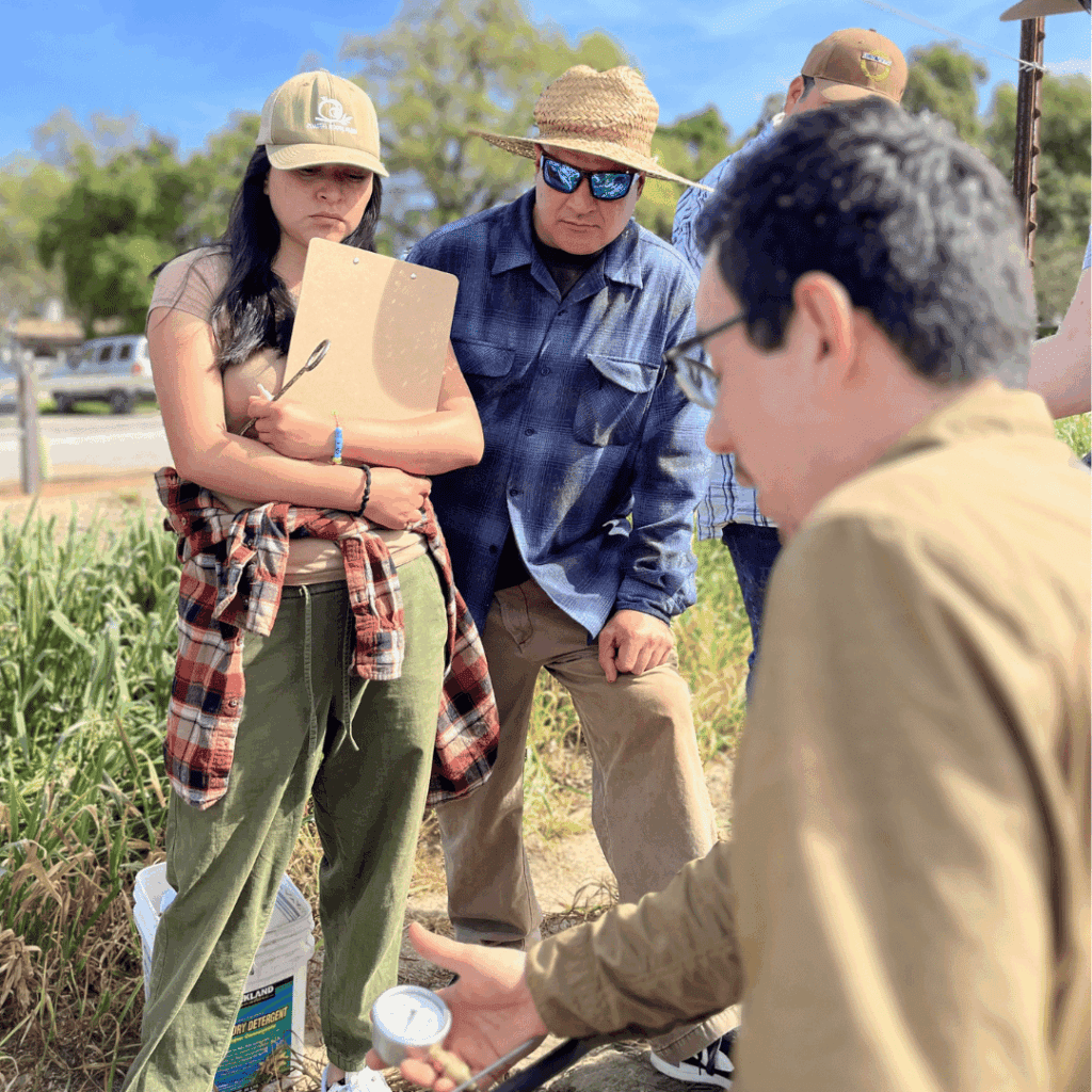 group of people learning about irrigation