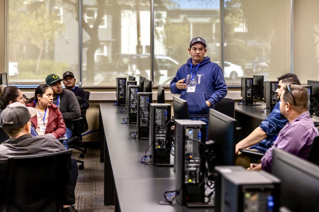 AgHiRE participants learning new digital literacy skills.