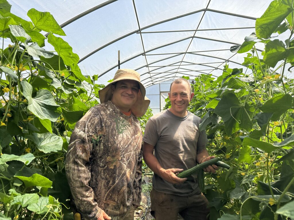 California Farm Academy and Apprenticeship veteran alum Richard Escamilla and Bootstrap Hill Farm owner Ross Lee in the greenhouse